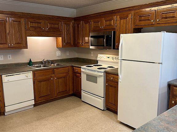 Kitchen amenities include stove, new microwave, new disposal, dishwasher, and refrigerator.