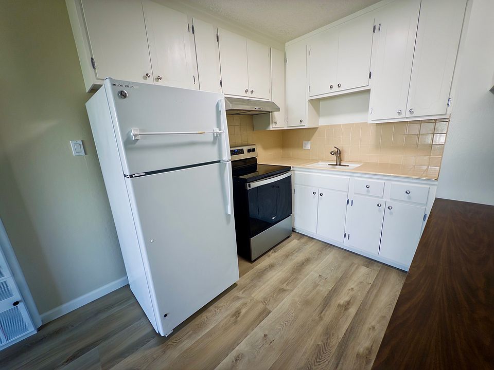 Kitchen with updated electric range and new hood