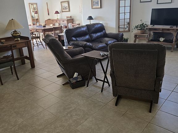 Living area with dining room in background