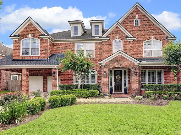 A covered front porch and porte cochere only add to the character of this incredible home. Just wait until you see the back yard and pool!