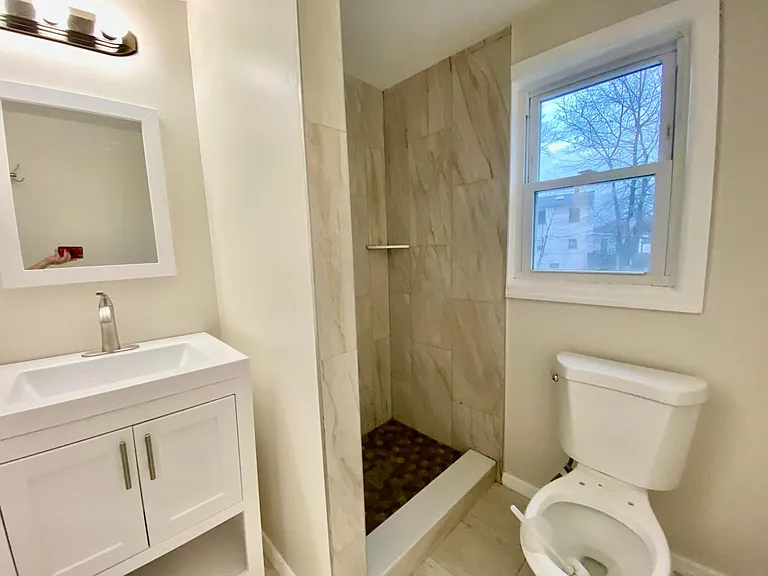 Master bedroom full bath. Stall shower, vanity, toilet and window. Brand New!
