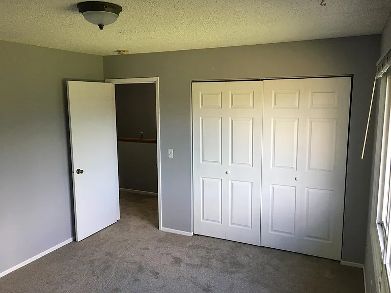 Large 2nd bedroom with large closet, overlooks backyard.