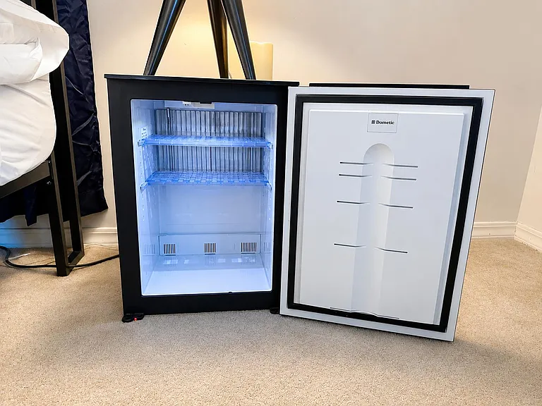 In-room mini fridge provides convenient cold storage for drinks and snacks, helping keep essentials close at hand.