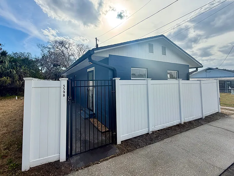 Inviting 1-bedroom, 1-bath solid block home with vinyl fenced property adds privacy and safety.