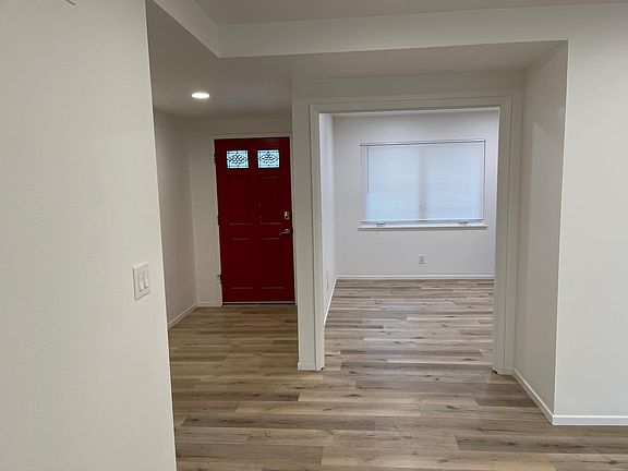 View from living room facing front entrance and dining room.