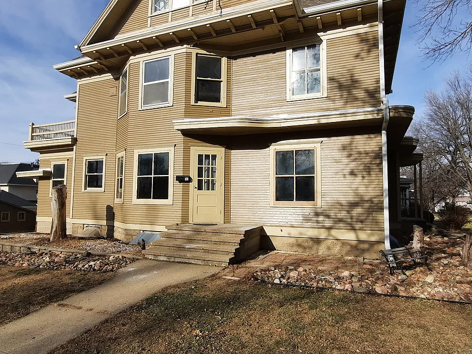 The unit is on the main floor of this house.