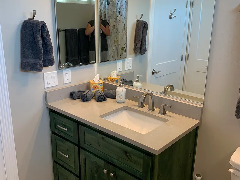 This is the full bath located off the entranceway of the home