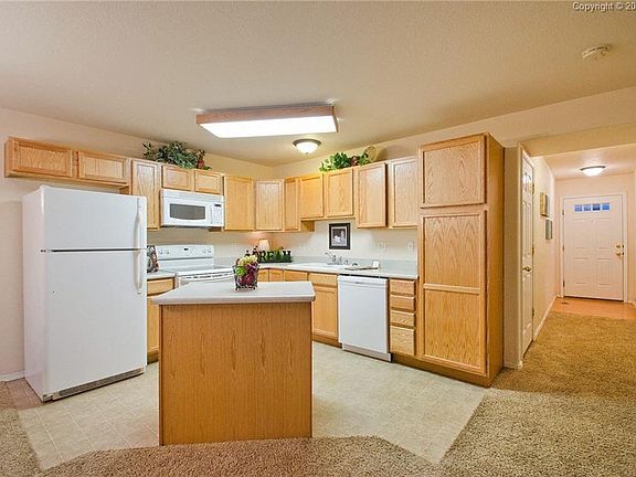 The hardwood floor entry has a coat closet. Under stair storage and crawl space 