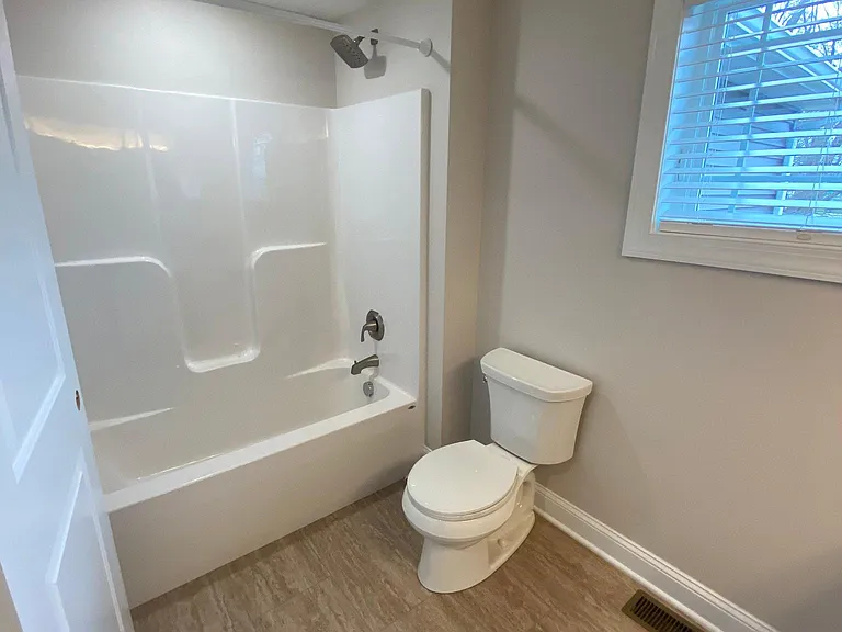 Full bath with tub shower