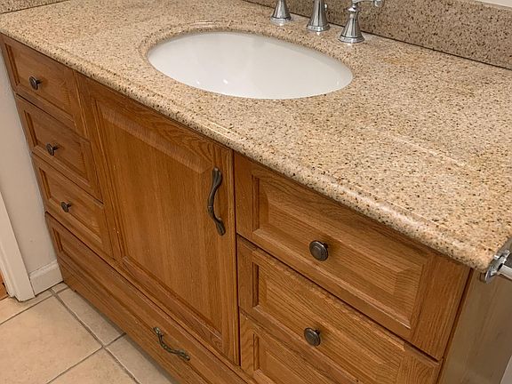 Granite counter top in bathroom and large storage draws.