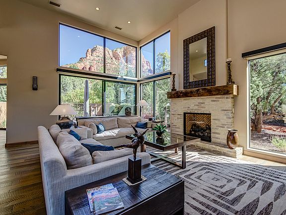 Living room with comfortable furnishings, gas fireplace, a smart TV and beautiful hardwood floors