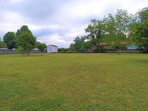 Large fenced backyard w/shed