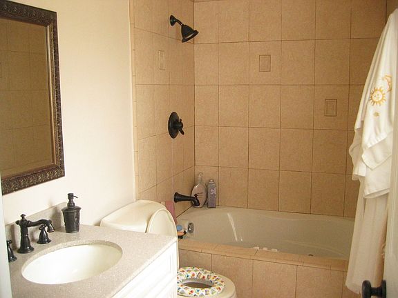 Private master bathroom with a Jacuzzi