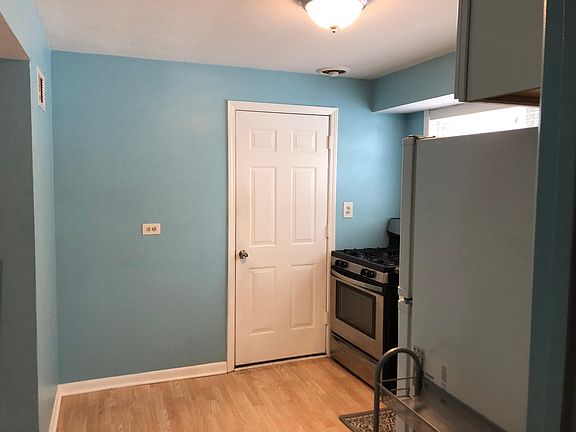 Kitchen - Different Angle with door leading out to the laundry room.