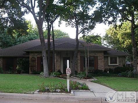 FRONT OF 337 INVERNESS DR., TROPHY CLUB.  ONE STORY ON TREED LOT