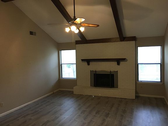 Great room with fireplace and vaulted ceiling