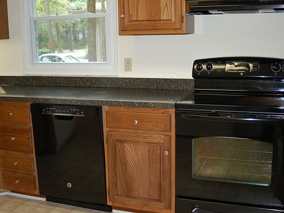 Great Room open to kitchen on left and leads to Screened Por