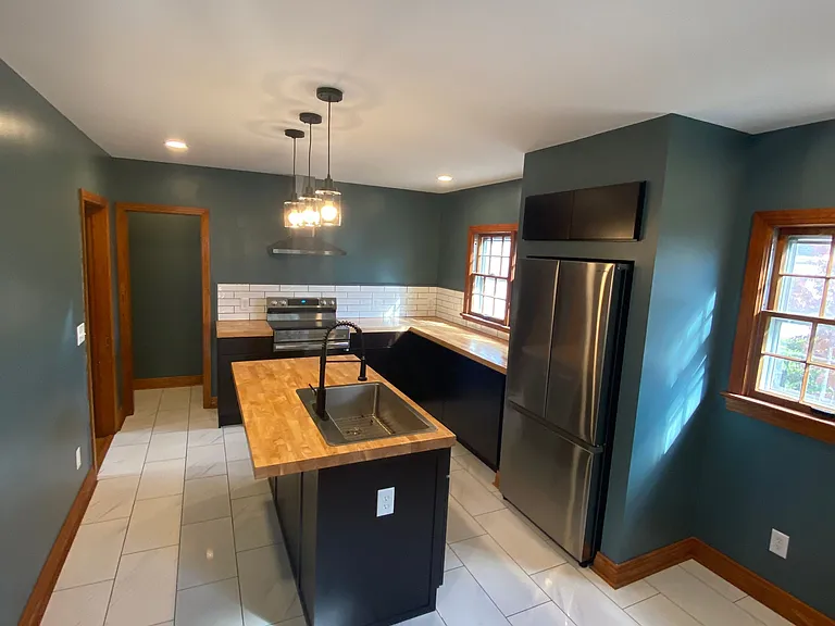 Brand new kitchen with all new appliances, fixtures, and enough space for a breakfast nook table & chairs.