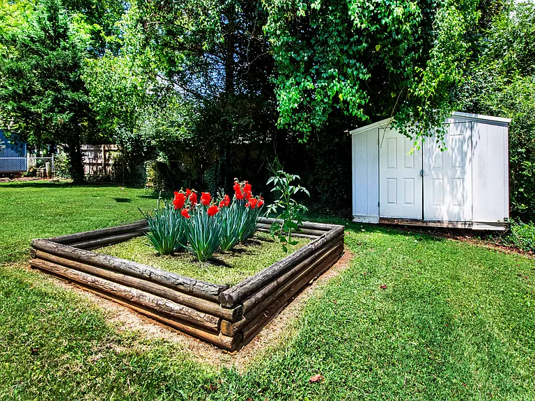 The above ground garden is waiting for you to plant your tomatoes
Don't forget about the shed as it comes in handy for bikes etc.