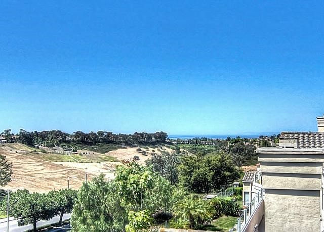Sweeping ocean, sunset, Catalina Island and hillside views.