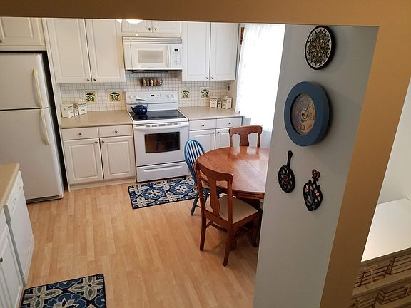 View of kitchen from stairs.