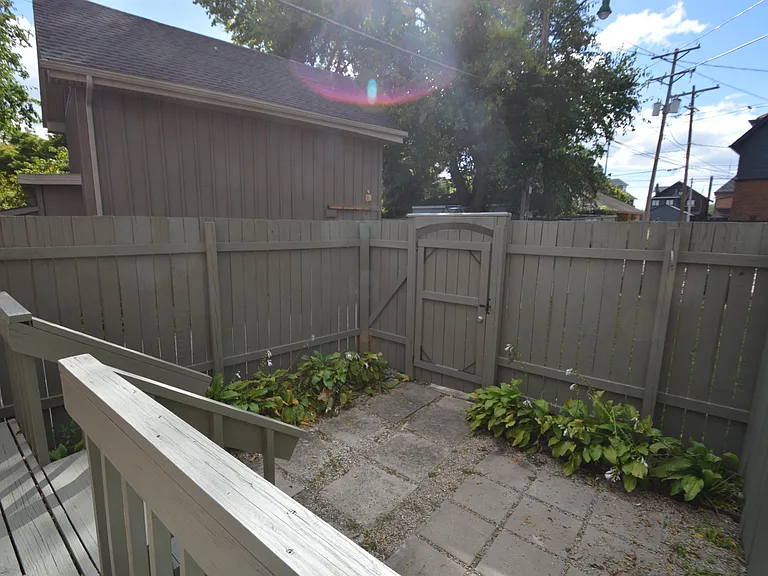 Patio area with pavers and fully fenced for privacy.