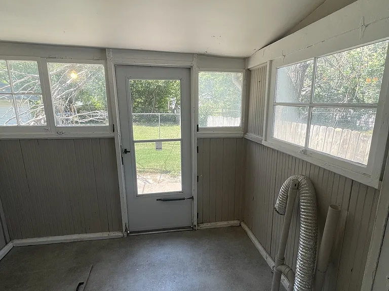 Laundry room, back yard access.