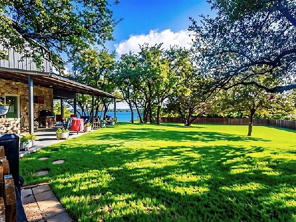 Large Oak Tree Shaded Yard with Lake Views from the Yard and Covered Patios and Screened in Porch