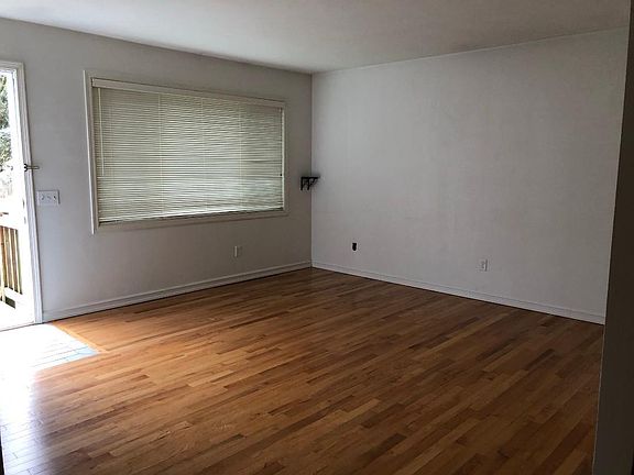 Living Rm. The front door to the left, the hall is to the far right.