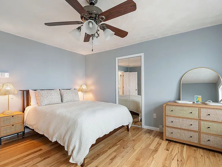 Second bedroom with plush queen sized bed and plenty of clothes storage
