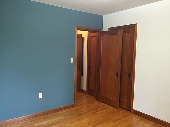 Back bedroom/office showing accent color wall.