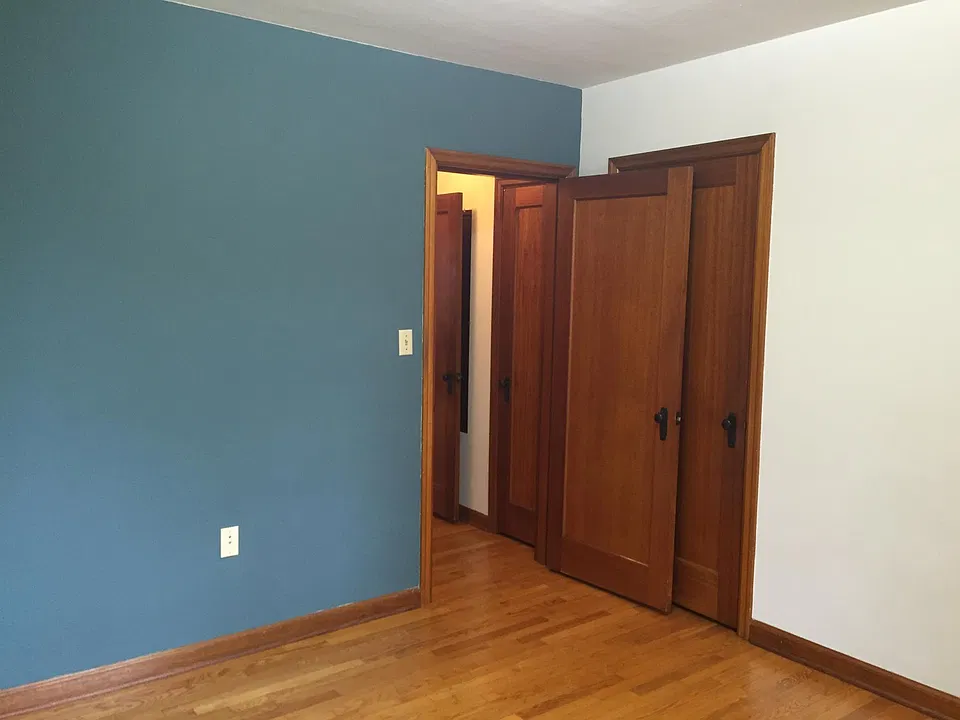 Back bedroom/office showing accent color wall.