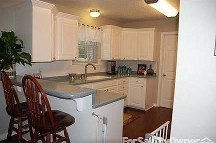 Kitchen : Updated floors, Corian countertops, new stainless steel dishwasher & stove/oven.