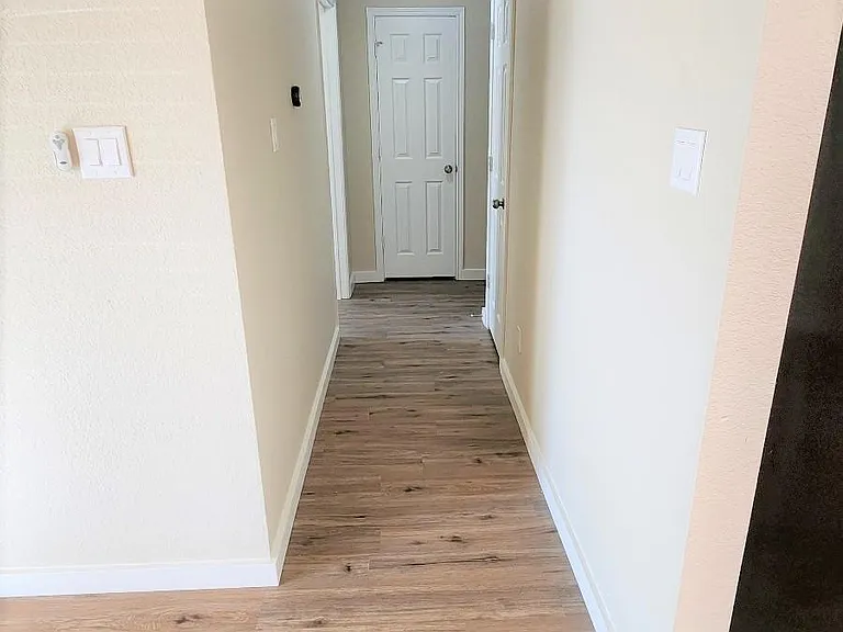 Alexa-controlled thermostat in the hall.