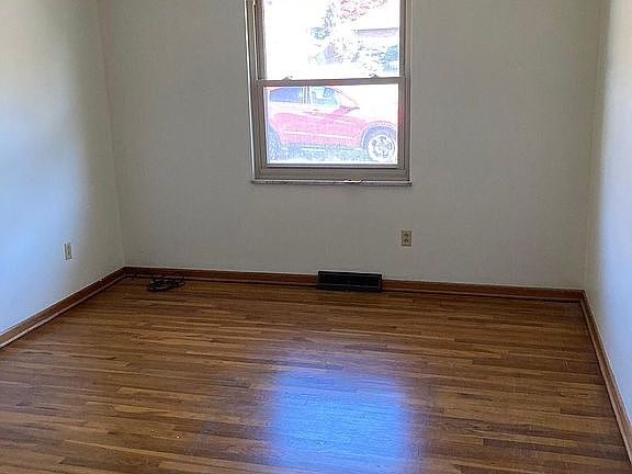 Sizable bedroom with double pane window, gorgeous hardwood floor and large closet