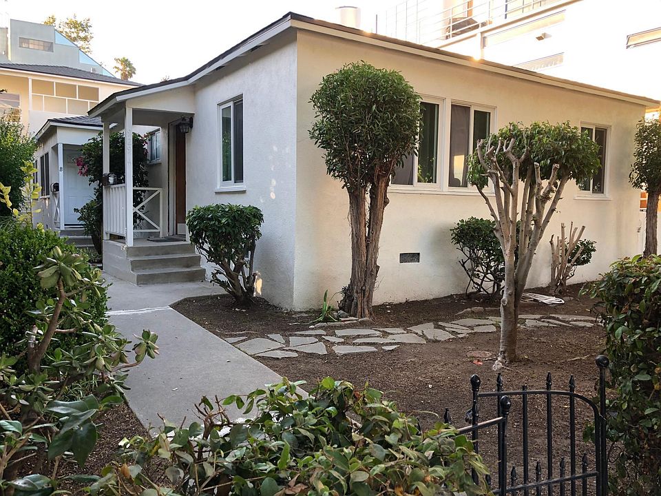 main photo of three unit building, rear unit completely detached