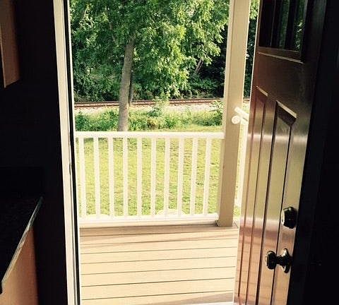 View of the private yard looking out the front door