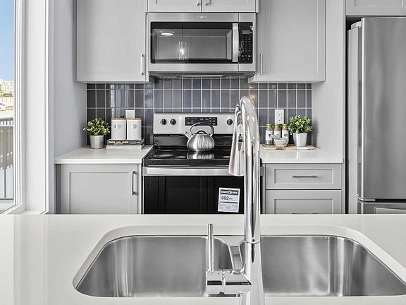 A photo of the kitchen of the Coltrane townhome model by Brookfield Residential
