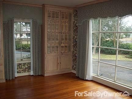Formal dining room w/ built-in cabinets