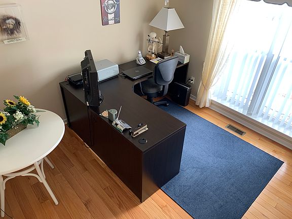 Bed 1 fan and wood floor 