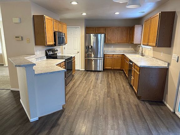 New wood flooring and new carpet throughout.