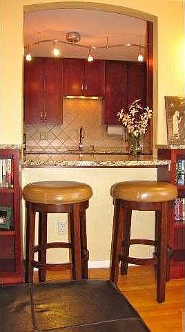 Granite Breakfast Bar with pass through from the kitchen to the living room.