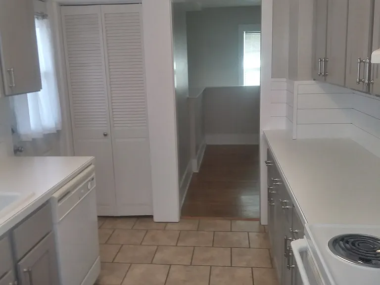 Walk in pantry behind bifold doors