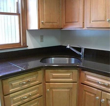 Newer cabinetry and quartz countertop