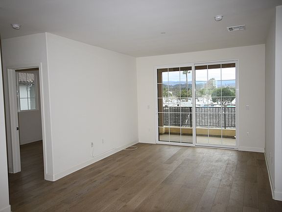 This is halfway in after entering the front. This is the living room area with large porch.
