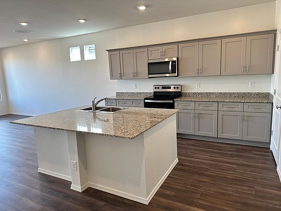 Large kitchen with granite countertops, stainless steel appliances, walk in pantry, soft close cabinets
