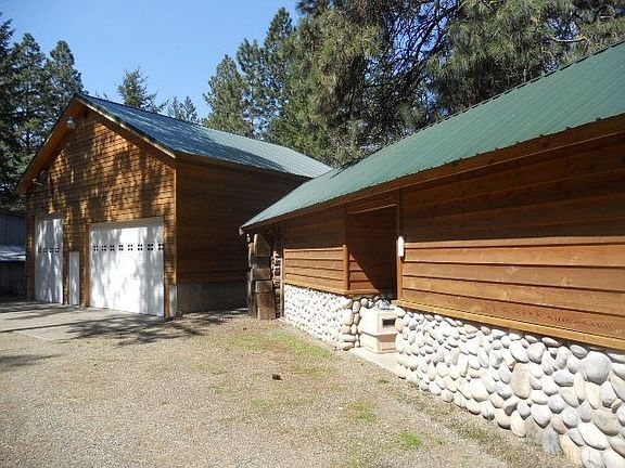 Additional out building can be used for storage, Craft room. 4 car geated garage with bathroon and s