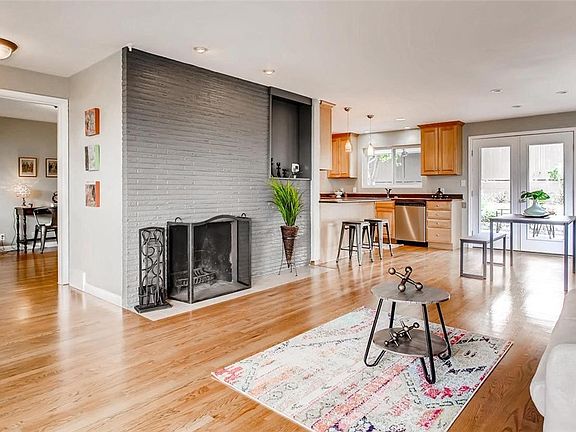 Living room seamlessly flows into dining area, kitchen and out into the fabulous private patio.  Floor plan is ideal for those who love to entertain.