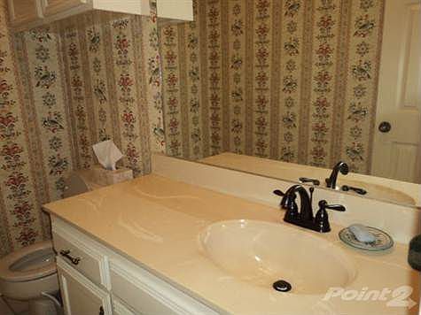 large powder room off kitchen& garage