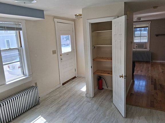Pantry in kitchen. Living room is straight ahead. To the right (unseen here) is the half bath.